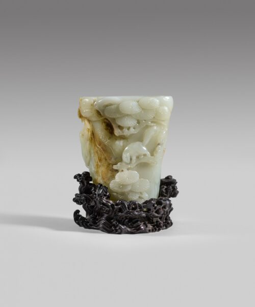 A white and russet jade 'pine' rhyton