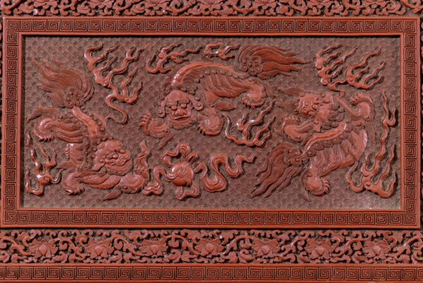 A rare imperial cinnabar lacquer ‘Buddhist lions’ treasure box and cover (Qianlong six-character and Suanni Baohe four-character marks and of the period)