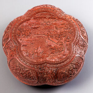 A carved cinnabar lacquer pentafoil box and cover (Qianlong period, 1736-1795)