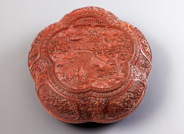 A carved cinnabar lacquer pentafoil box and cover (Qianlong period, 1736-1795)